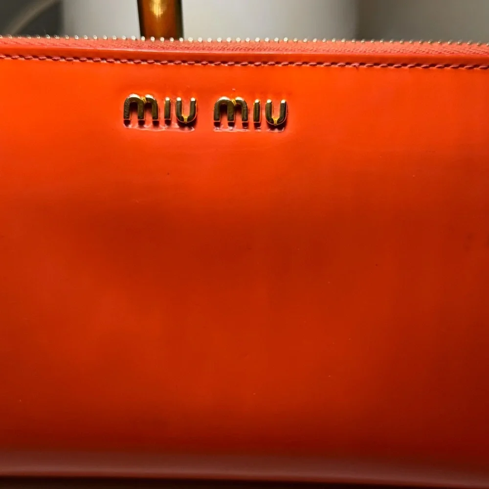 Miu Miu Bright Orange Leather Clutch